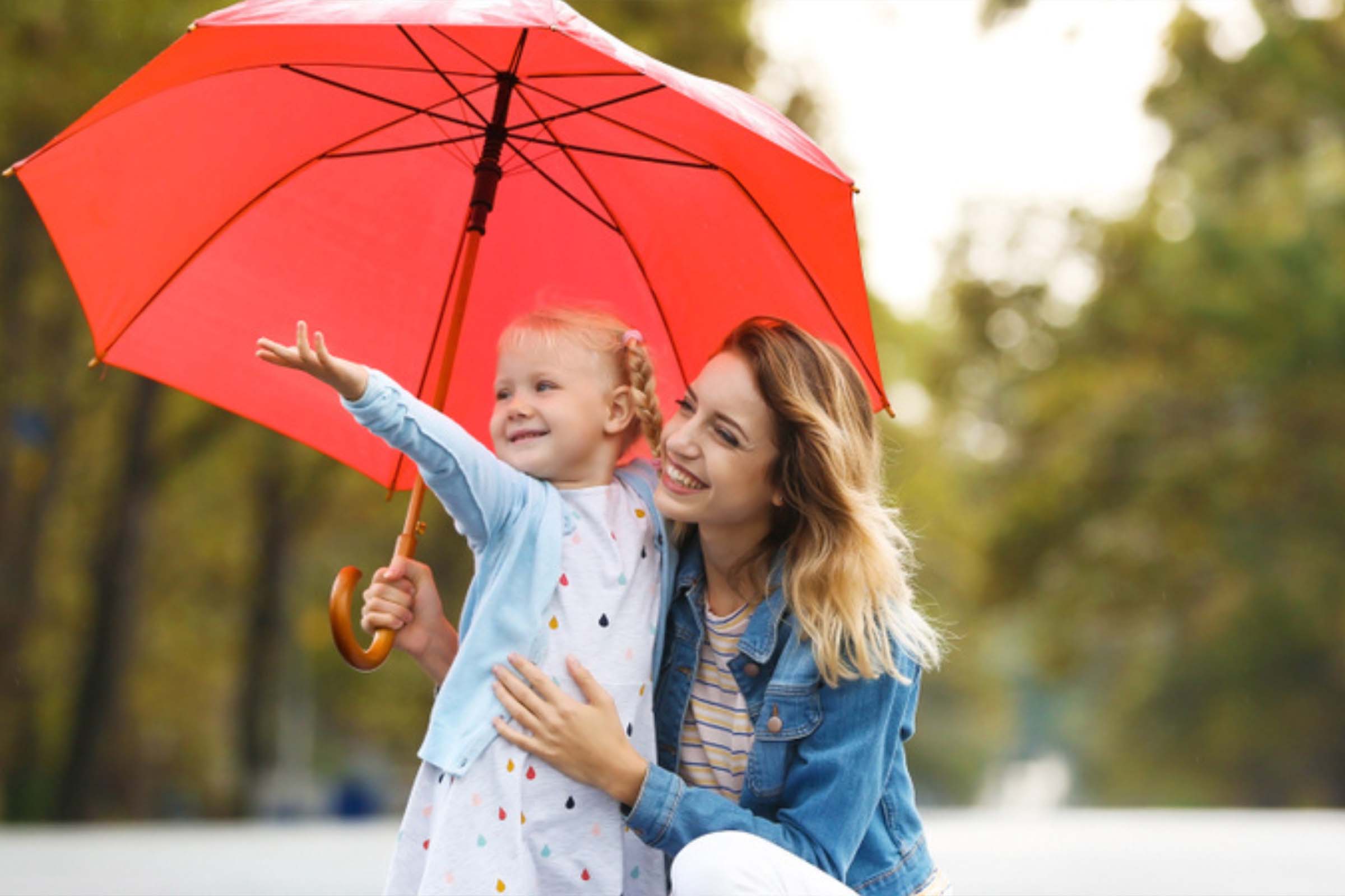 Mother and daughter with umbrella
